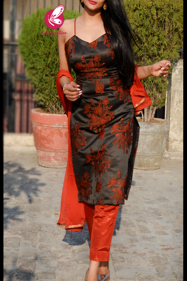 Rust Silk Floral Motifs Embroidered Padded Kurti with Rust Shantoon Pants and Rust Chinnon Golden Lace Stole