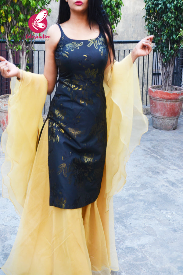 Black Golden Brocade Padded Knee Length Side Slit Kurti with Golden Organza Sharara Paired with Golden Organza Three-Tier Ruffle Stole