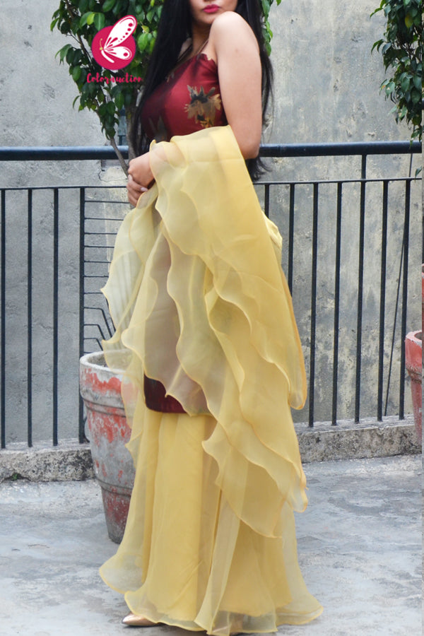 Rust Maroon Brocade Padded Kurta with Golden Organza Sharara and Golden Organza Three-Tier Ruffle Stole